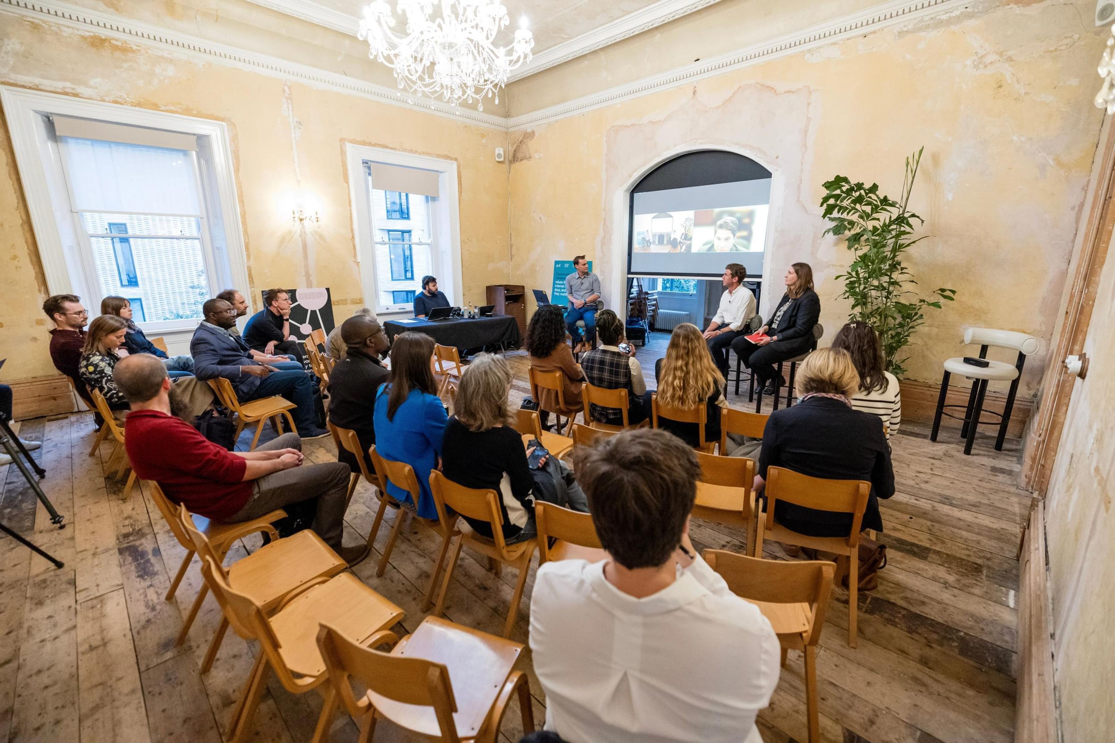 A big room with people during an intimate conference