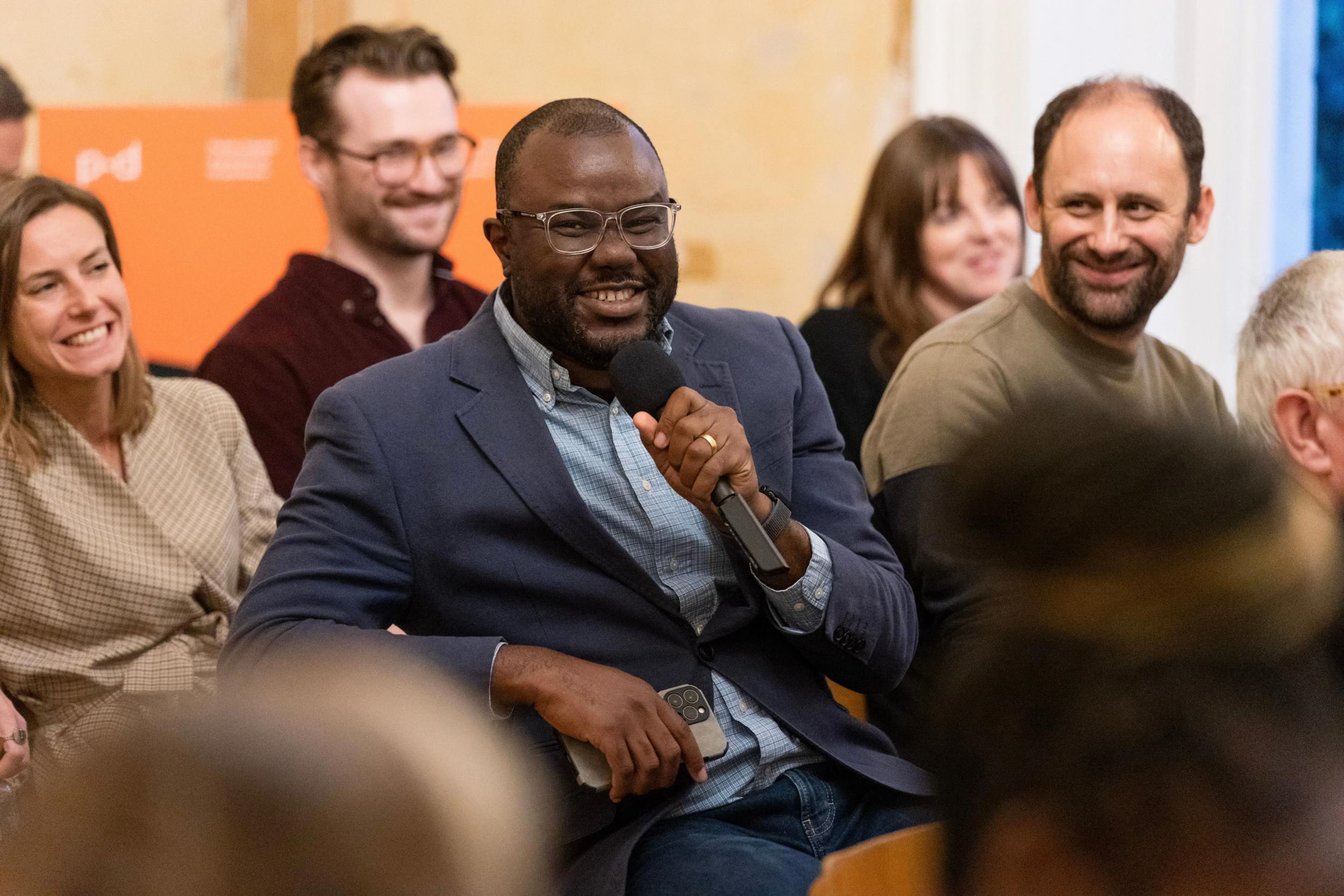 A man asking a question from the audience