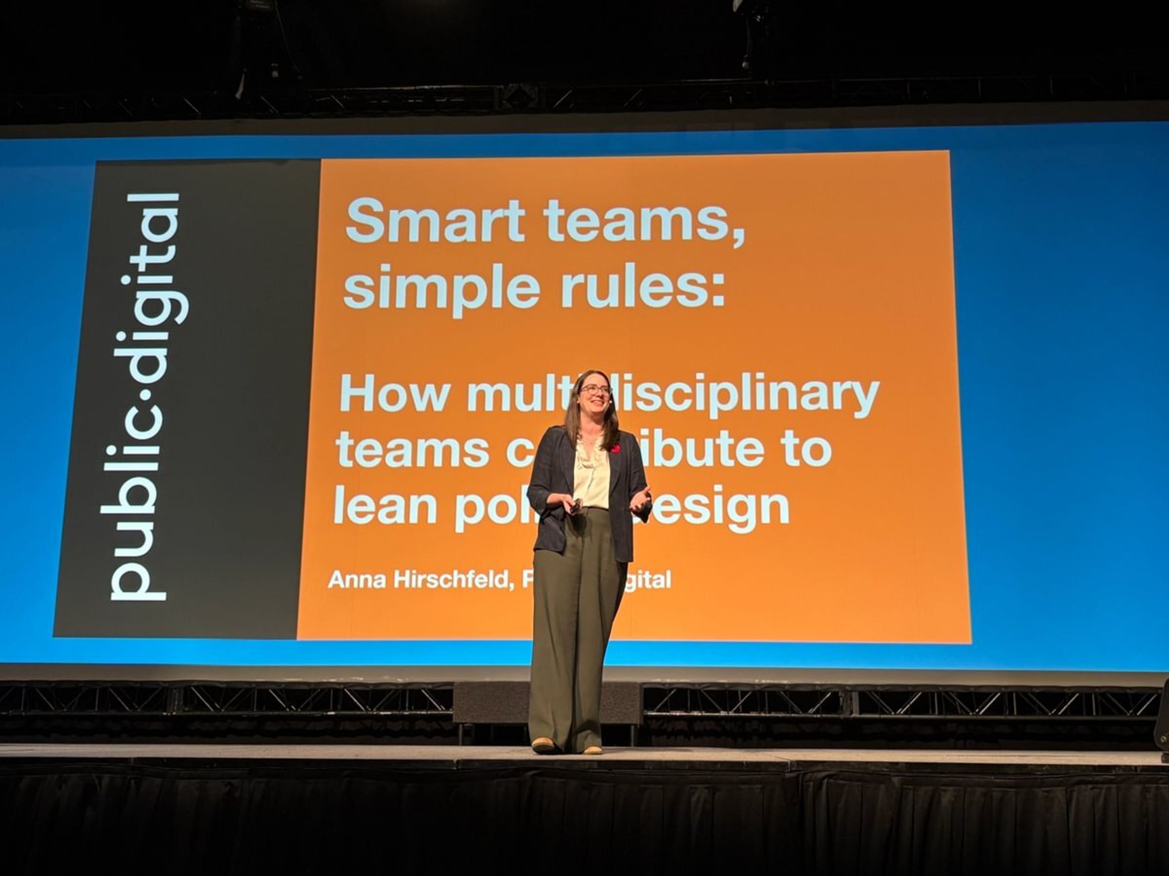 Anna Hirschfeld giving her presentation in front of a slide that says smart teams, simple rules