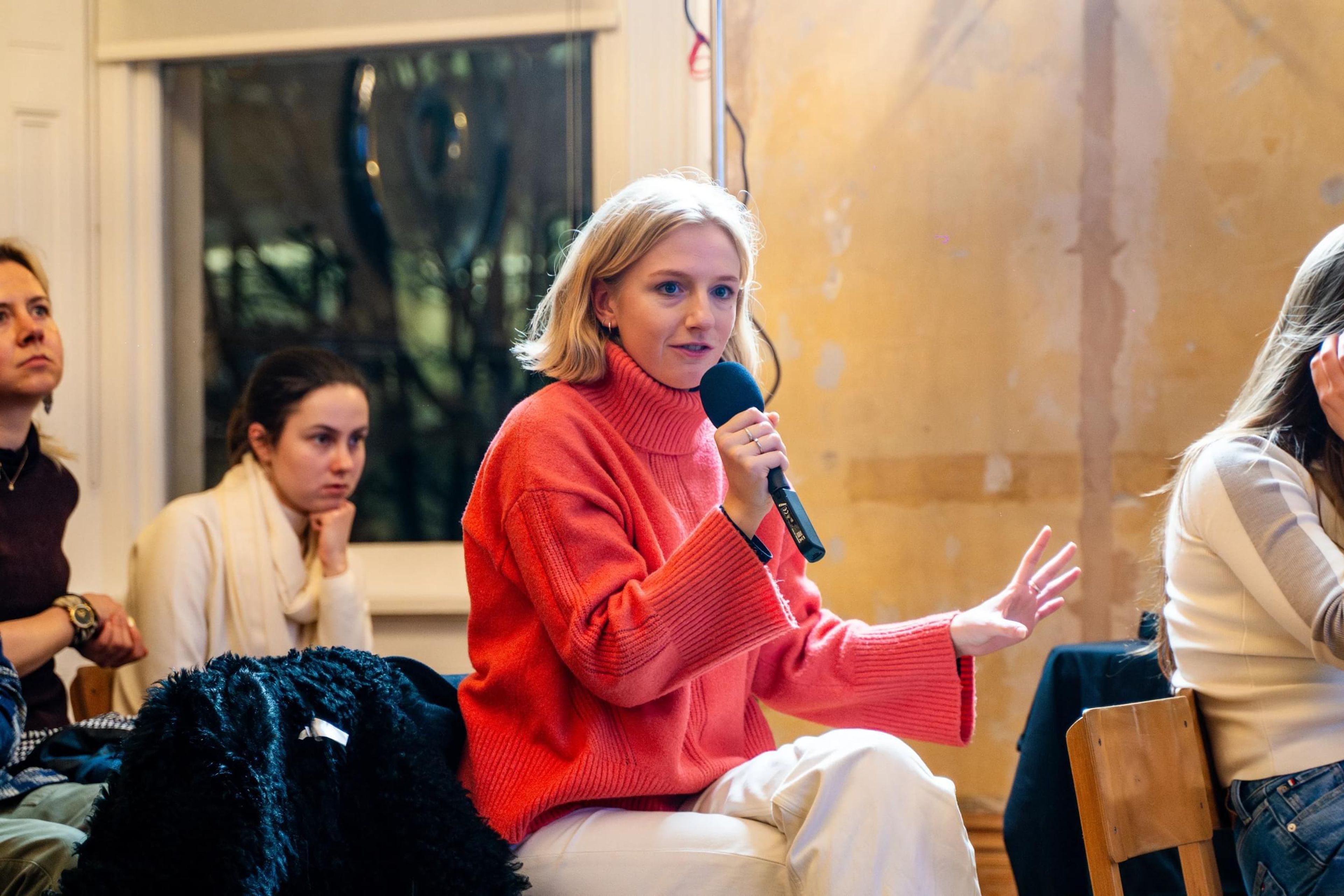 Woman from the audience asking a question