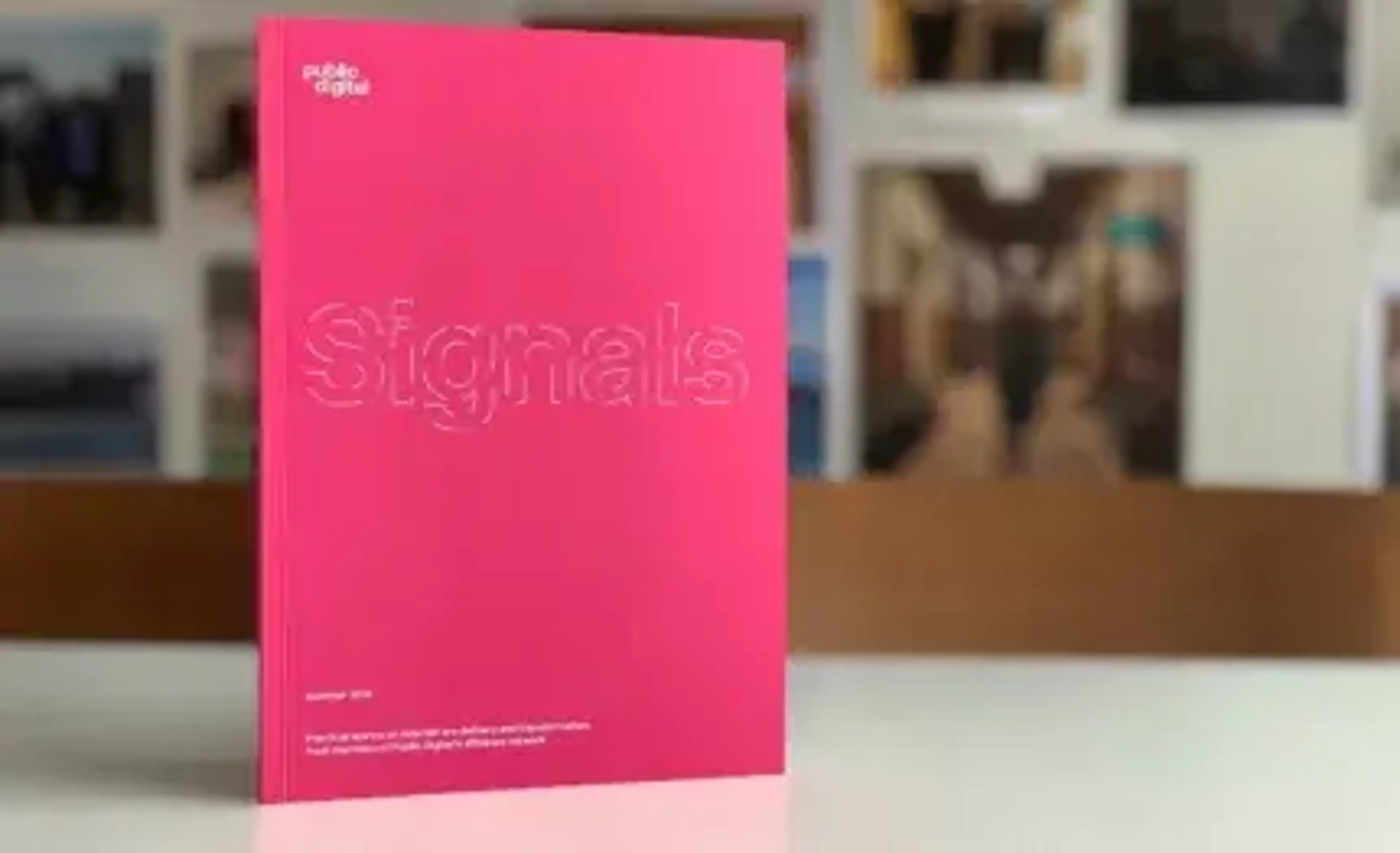 Signals book standing on table