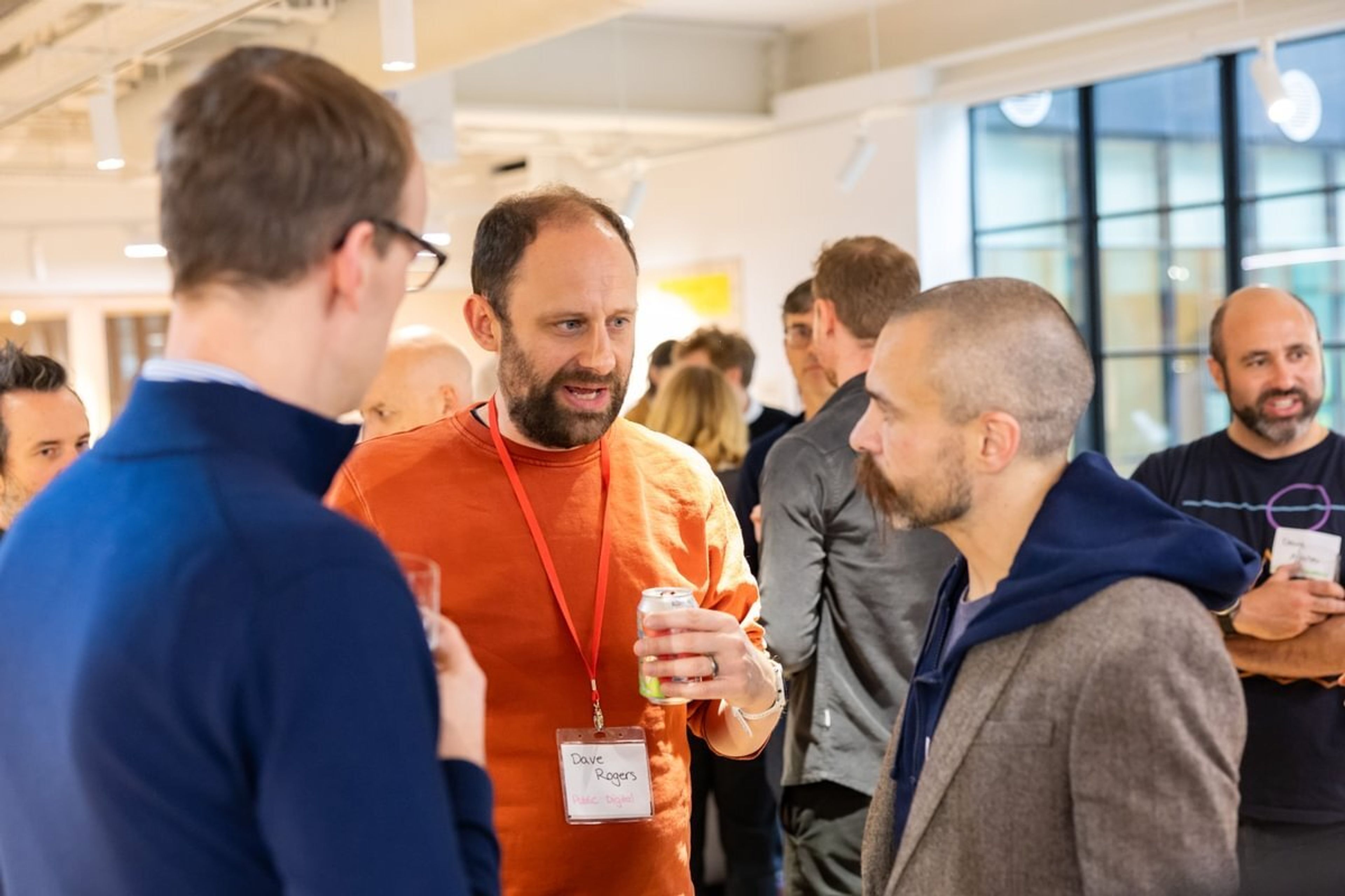 Three people speak in a networking event