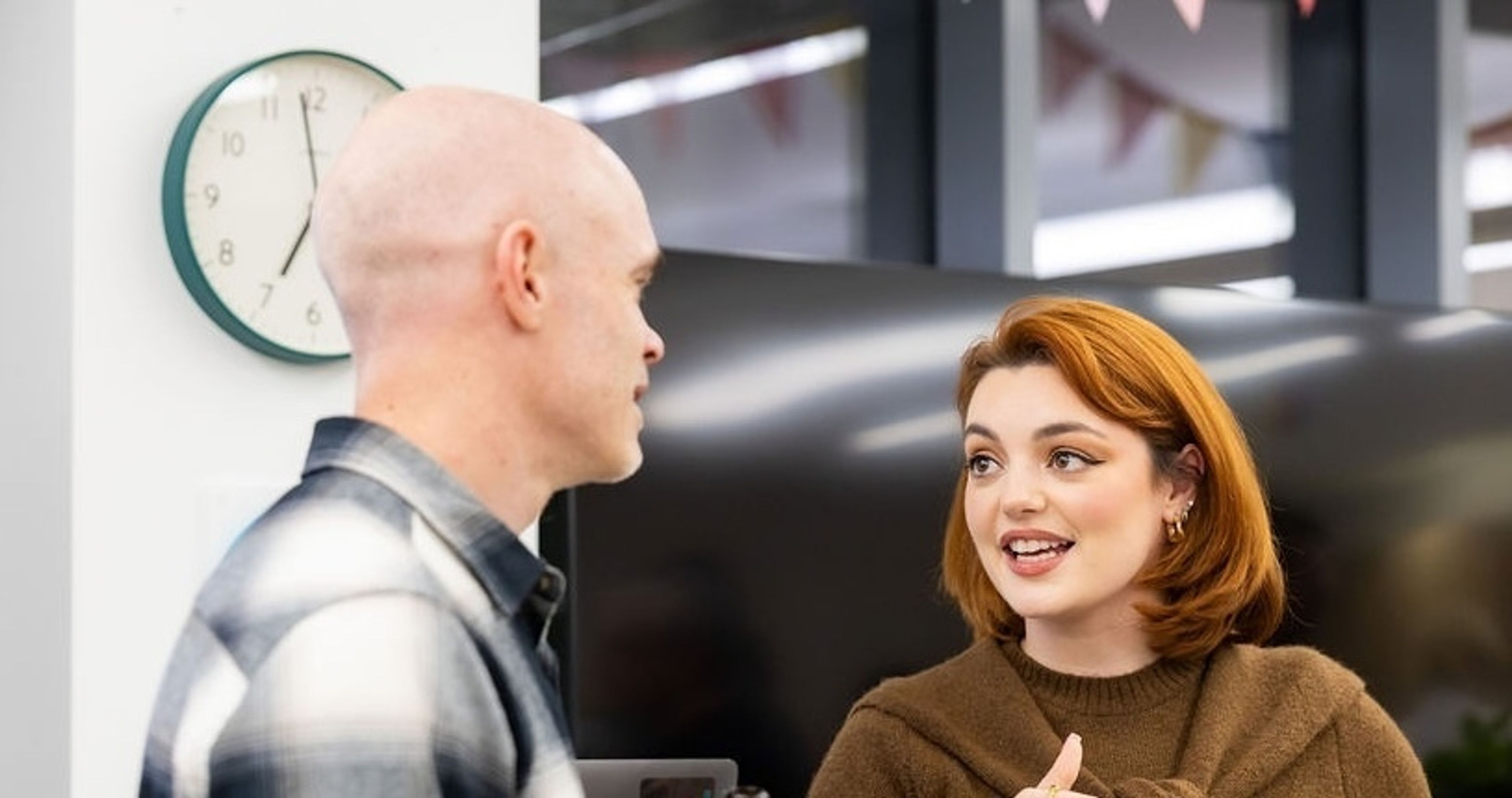 A photo showing our Client Delivery Resourcing Lead, Holly Roscoe, speaking to a Network member at one of our network mixer events.