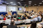 Delegates attend to speakers opening the ceremony