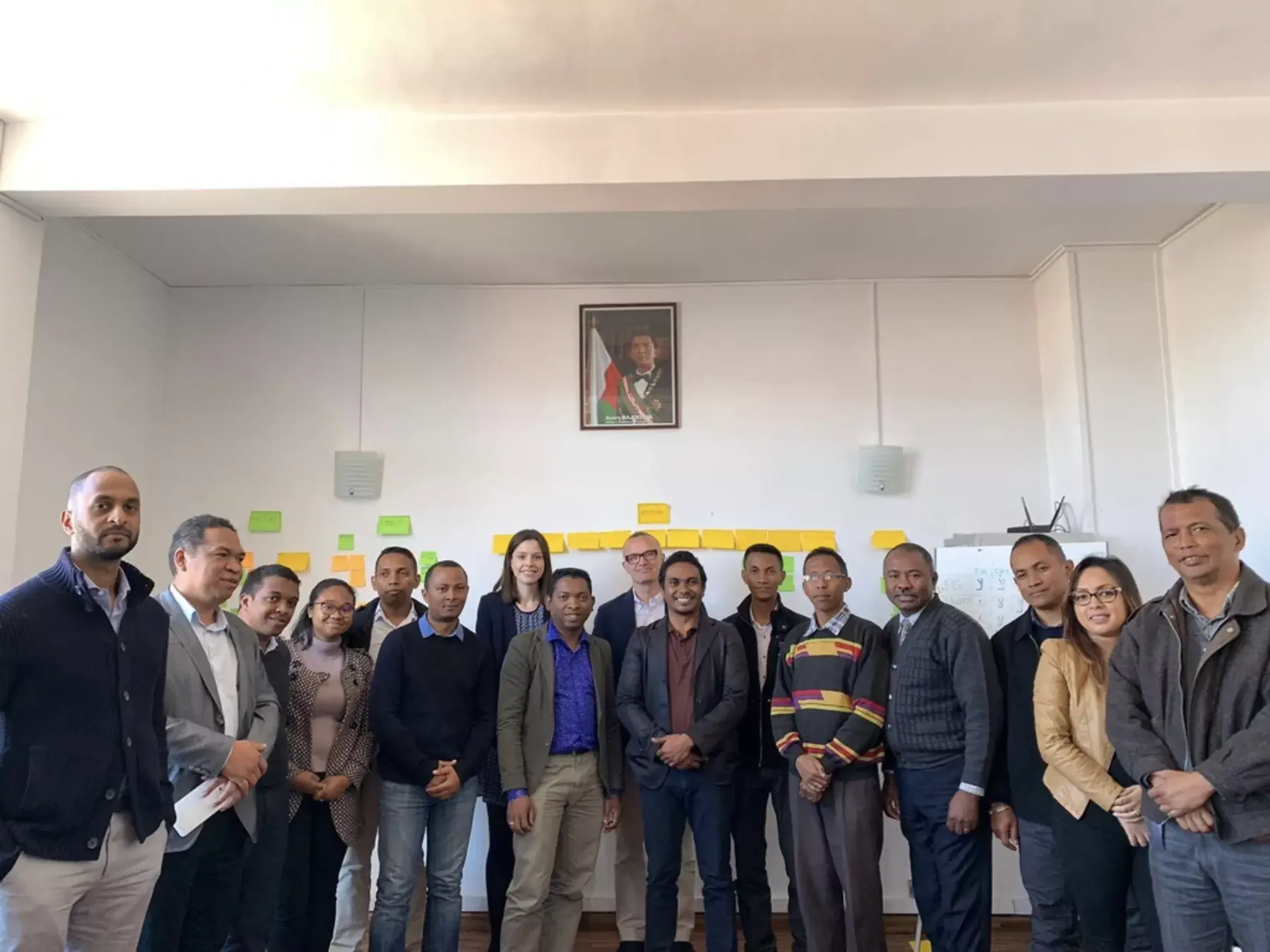 A workshop with civil servants across government, with Kishor from Caribou Digital (far left) with Emily and Ben from Public Digital (centre)